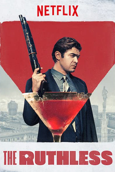 Netflix production "The Ruthless" poster with the main actor Riccardo Scamarcio holding a pumpgun in his right hand and wearing a suit.