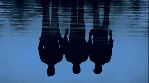 Dark poster with upside-down reflection of three men in a dark blue river with white Mystic River lettering on top and a white quote saying we bury our sins, we wash them clean at the bottom